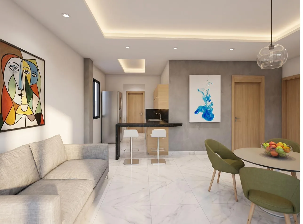 Sala con sofá gris, comedor y cocina con barra